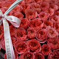 a basket of pink expression roses