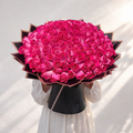 Fresh dark pink roses arranged as a bouquet