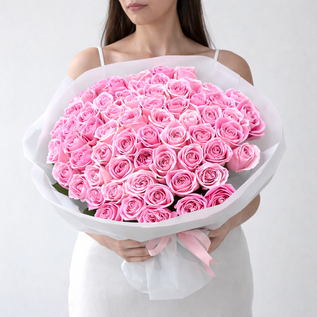 pink roses bouquet with a lady holding it