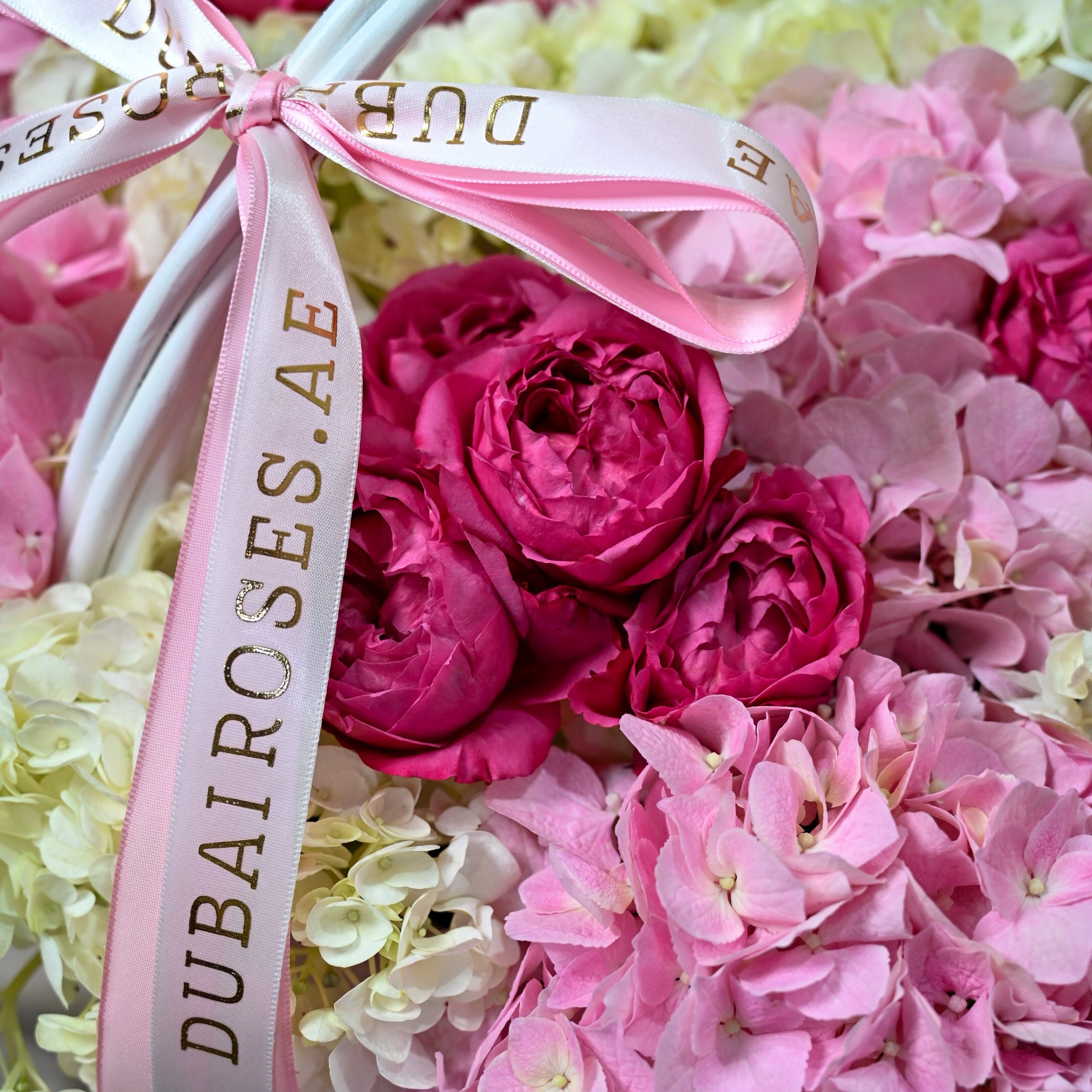 close up photo of white and pink hydrangea basket