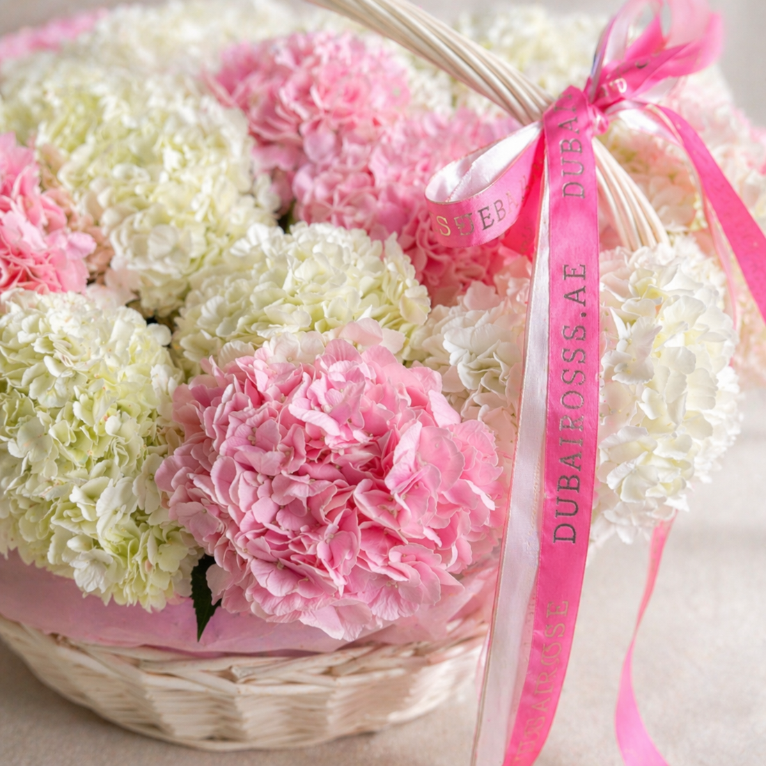 close up photo of white and pink hydrangea basket 