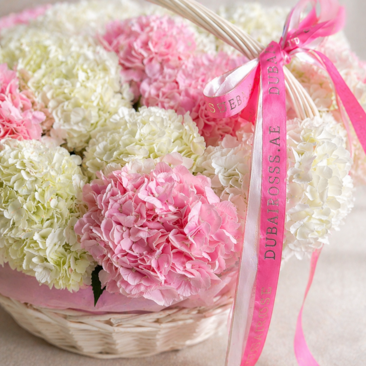 close up photo of white and pink hydrangea basket 