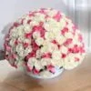 a bouquet of white and pink roses