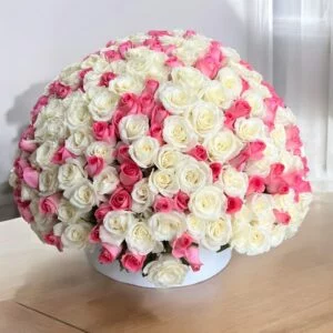 a bouquet of white and pink roses