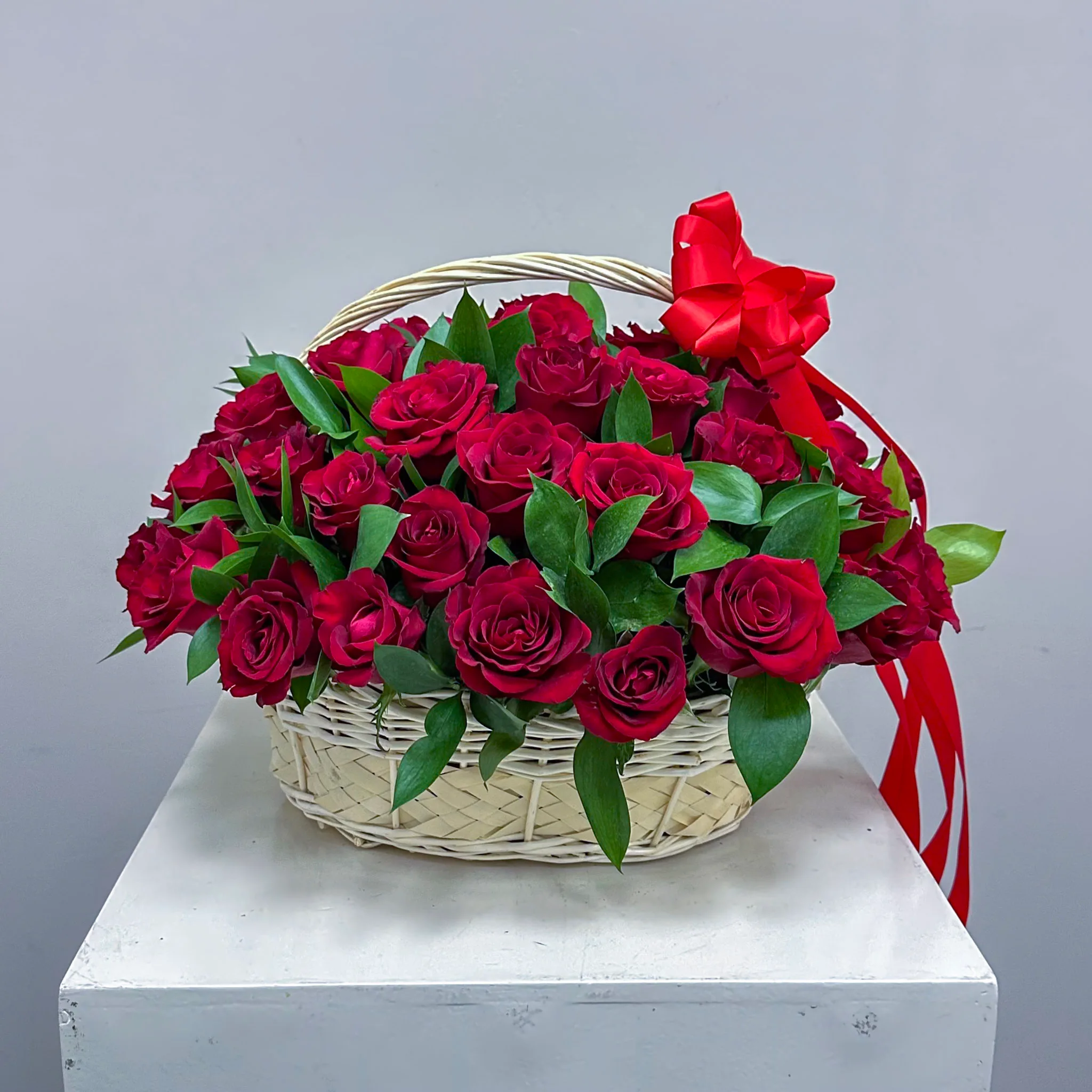 100 red roses in basket