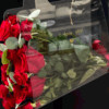 red roses in acrylic bag