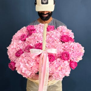 pink hydrangea with dark pink julieta roses in basket