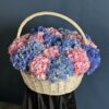 A basket of premium pink and blue hydrangeas