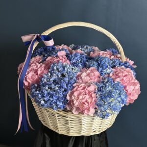 A basket of premium pink and blue hydrangeas