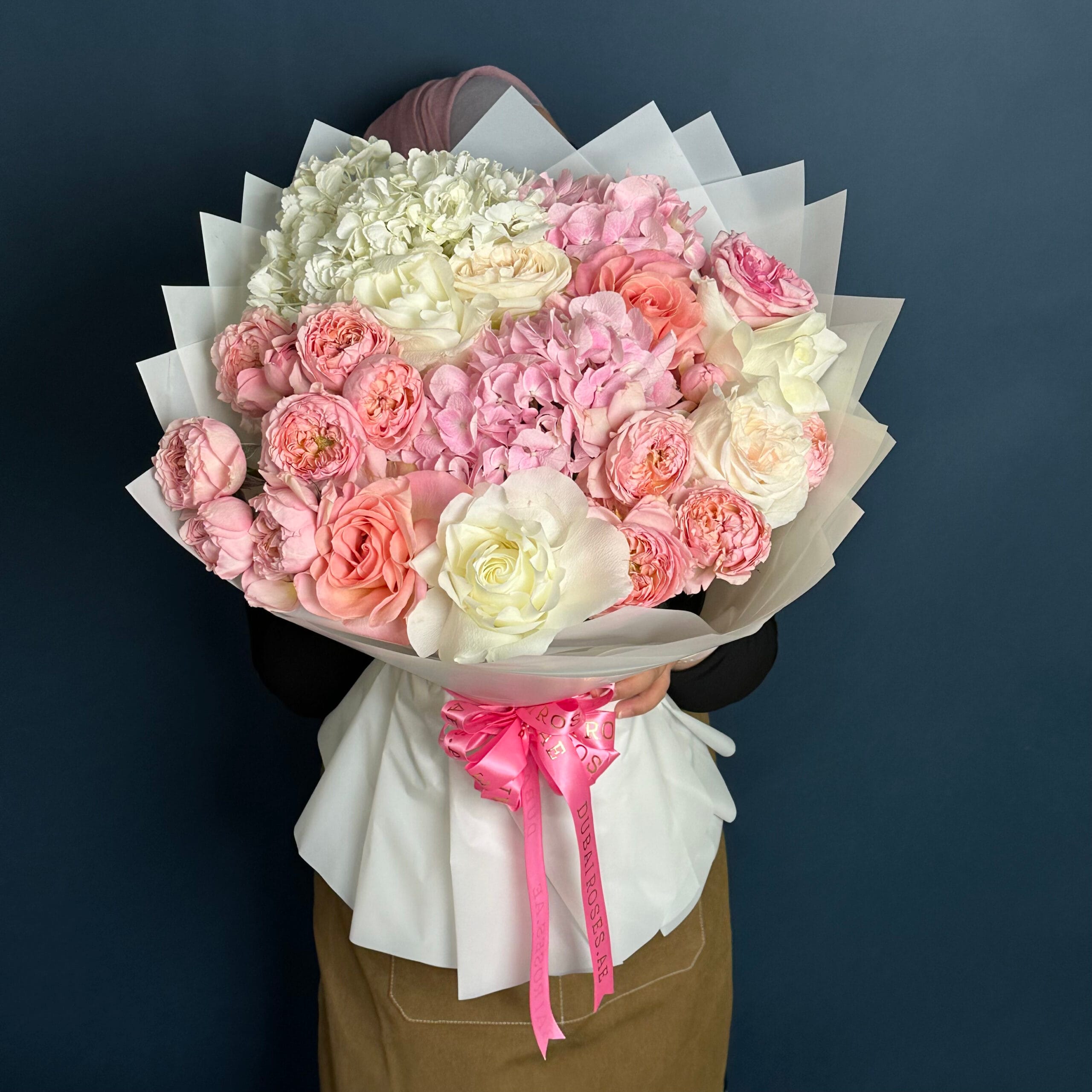 A bouquet combination of mixed flowers of white hydrangea, pink roses and pink hydrangea