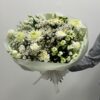 A bouquet composed of premium white chrysanthemum, white carnation, white vax, and white spray roses